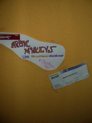 The ticket for the Arctic Monkeys Concert in D&uuml;sseldorf and a painting on my wall :)